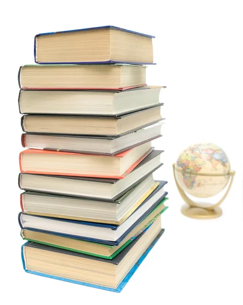 Stack of books and a globe on a white background — Stock Photo, Image