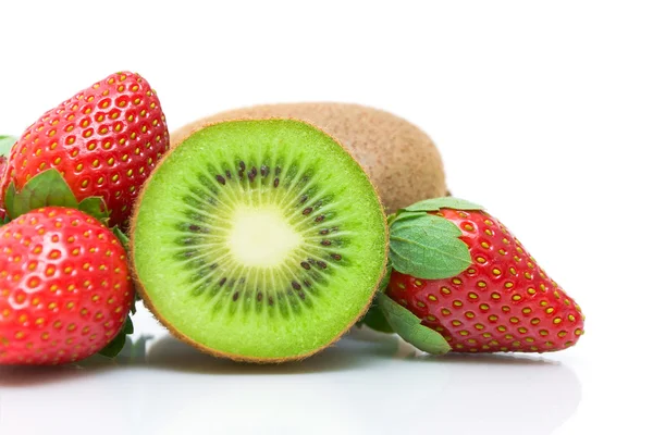 Half kiwi and strawberries close-up on white background — Stock Photo, Image