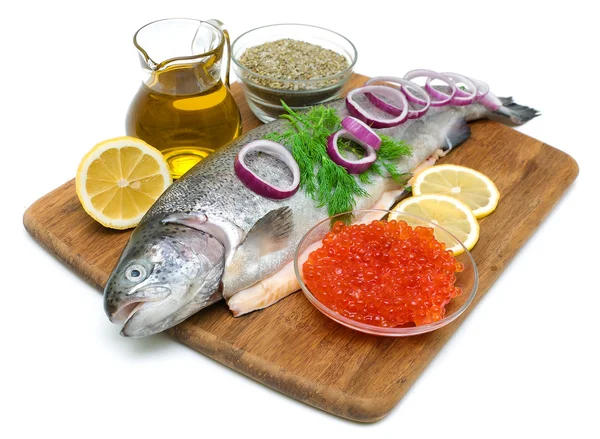 Trout, vegetables, spices and red caviar on white background — Stock Photo, Image