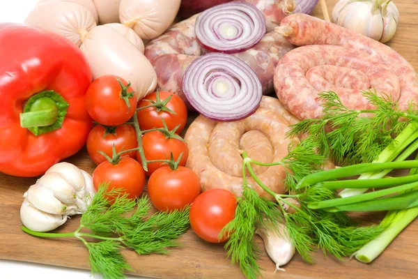 Sausages, vegetables and greens closeup — Stock Photo, Image