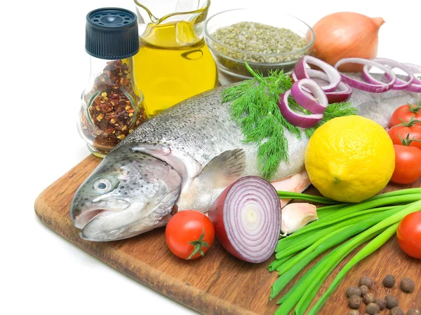 Fresh trout, vegetables, lemon and spices close up — Stock Photo, Image