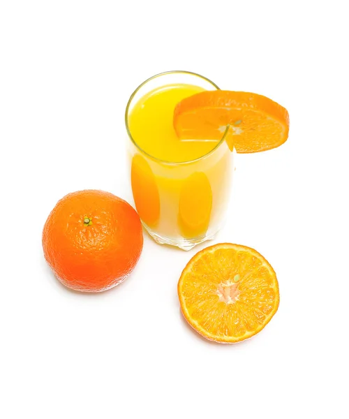 Orange juice in a glass and oranges - top view — Stock Photo, Image