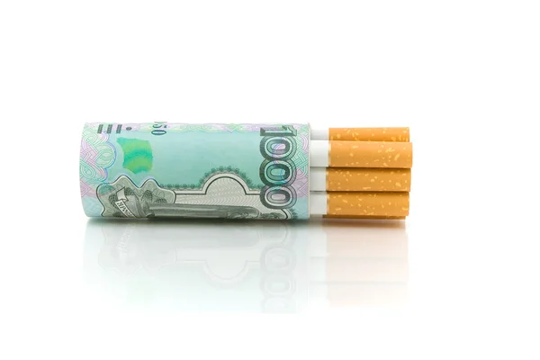 Cigarettes and money on a white background close-up — Stock Photo, Image