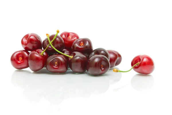 Bunch of ripe cherries on a white background with reflection — Stock Photo, Image