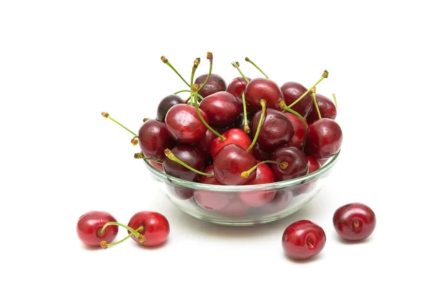 Cherries in a glass bowl on a white background — Stock Photo, Image