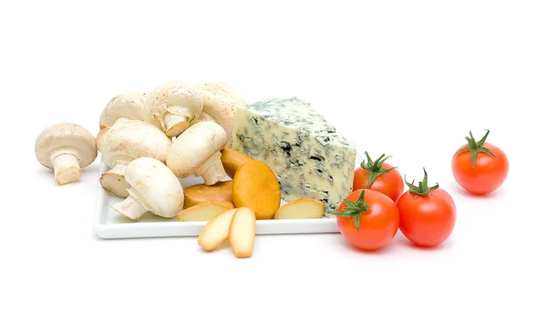 Mushrooms, cheese and cherry tomatoes isolated on a white background — Stock Photo, Image