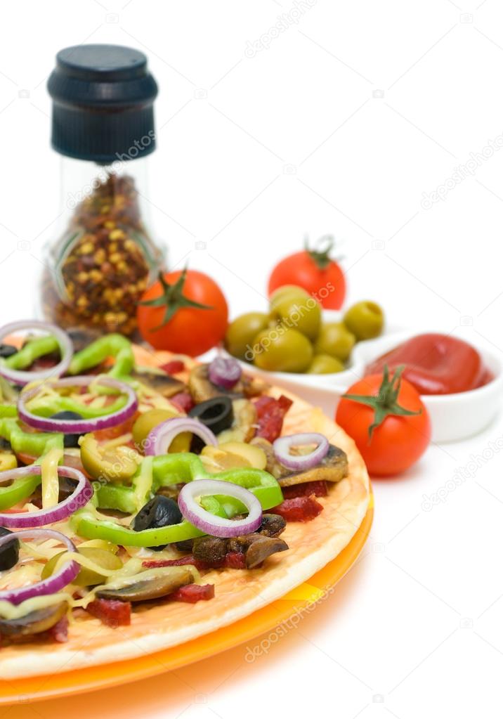 Pizza, tomatoes, olives and spices on a white background