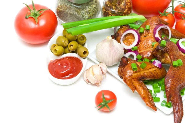 Delicious smoked chicken wings with vegetables on a white backgr — Stock Photo, Image