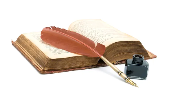 Inkwell, pen and an old open book on white background — Stock Photo, Image