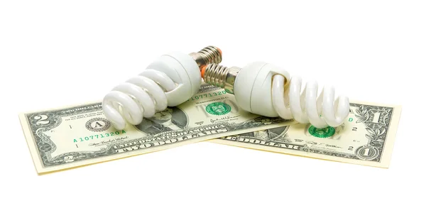 Two light bulbs and U.S. dollars isolated on white background — Stock Photo, Image