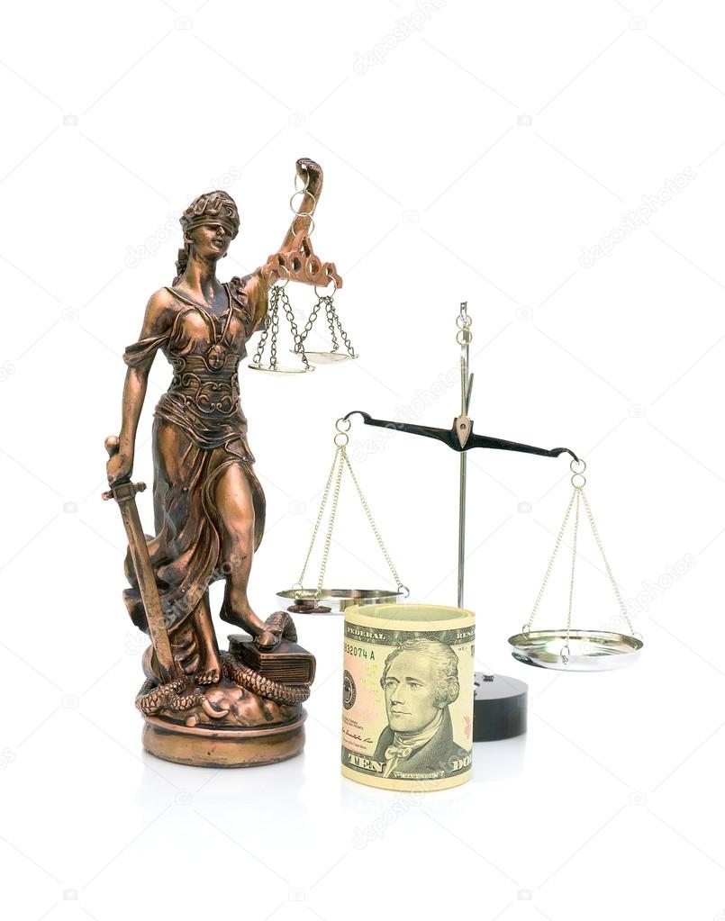 statue of justice and money on a white background. vertical phot