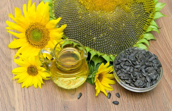oil and sunflower seeds, sunflowers close up. horizontal photo.
