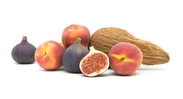 Peaches, figs and coconut isolated on white background — Stock Photo, Image