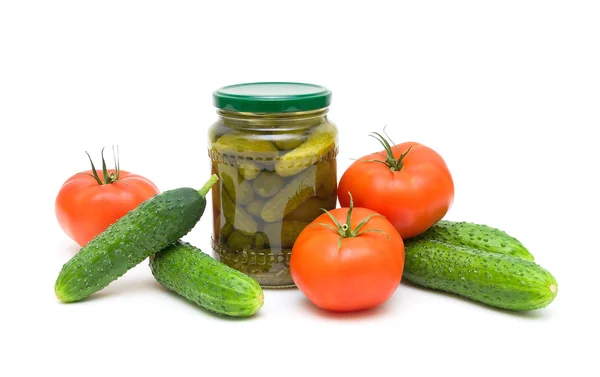 Fresh tomatoes and cucumbers and pickled cucumbers isolated on w — Stock Photo, Image