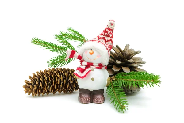 Snowman, cones and spruce twigs on a white background Stock Image