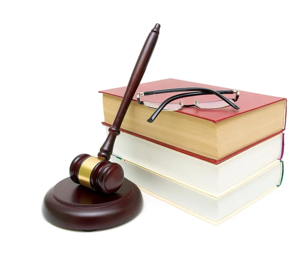 Gavel, a stack of books and glasses on white background — Stock Photo, Image