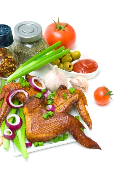 Smoked chicken wings and vegetables on a white background — Stock Photo, Image