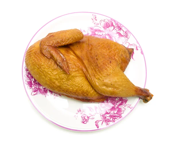 Καπνιστό κοτόπουλο σε ένα πιάτο σε ένα λευκό φόντο closeup — Φωτογραφία Αρχείου