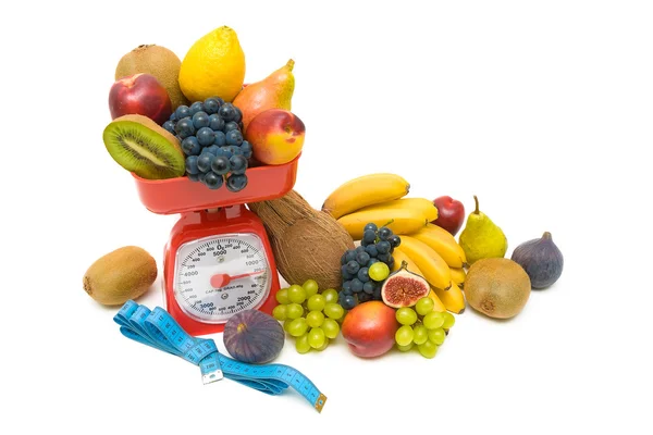 Fruit, measuring tape and kitchen scales close up on white backg — Stock Photo, Image