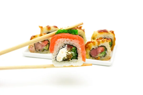 Japanese cuisine - rolls on white background — Stock Photo, Image