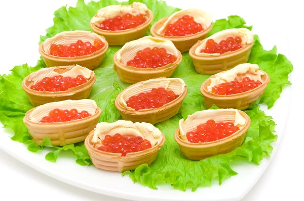 Tartlets with red caviar on a plate on white background — Stock Photo, Image