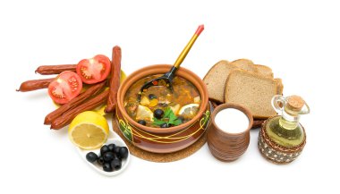 Dish of russian hodgepodge soup in ceramic pot and other foodstu clipart