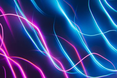 Neon blue and pink led lines on a dark night background. Kaleidoscope futuristic backdrop. clipart