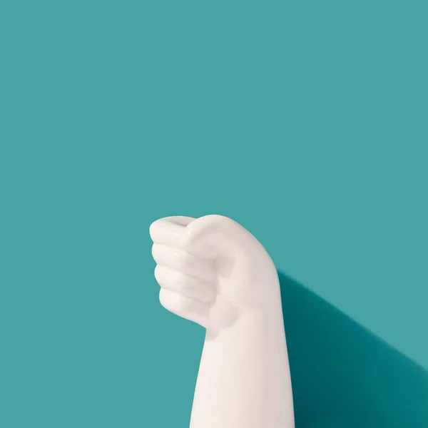 White Plastic Fist Teal Background Gift Present Minimal Concept — Stok Foto
