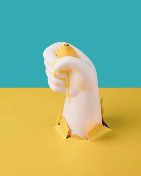 Concrete Hand Squeezing Lemon Yellow Juice Dripping Still Life Artistic — Stok Foto
