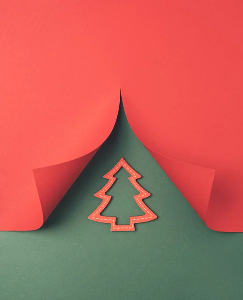 Christmas tree shaped cutout paper. Merry Christmas minimal background