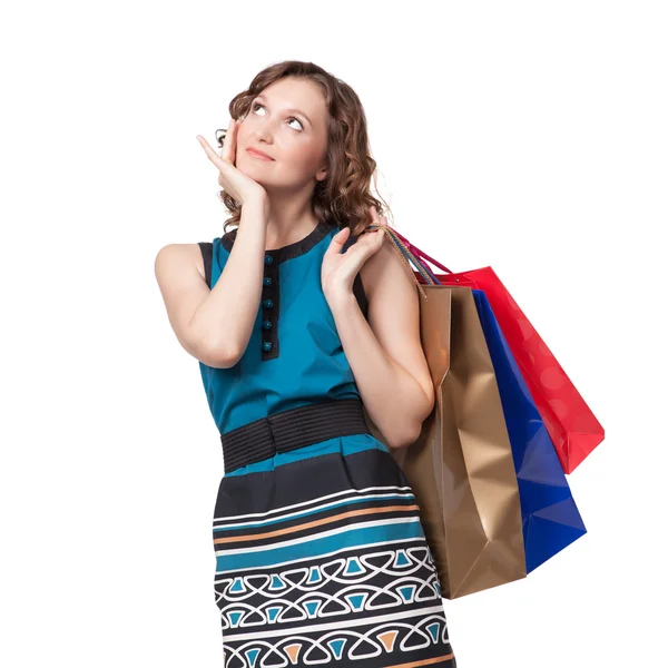 Retrato de una mujer joven que lleva bolsas de compras —  Fotos de Stock
