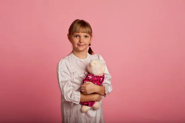 Little girl with a teddy bear — Stock Photo, Image