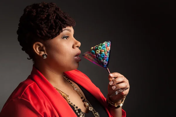 African American woman with a martini glass of fruity cereal — Stock Photo, Image