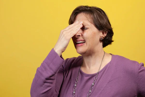 Attractive Mature Woman Purple Blouse Yellow Background Her Hands Her — Stock Photo, Image