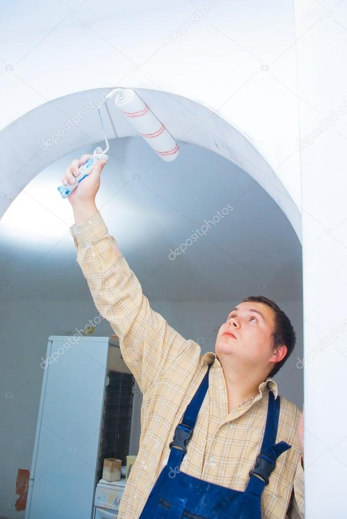 Worker paint the arc, make renovation indoor.