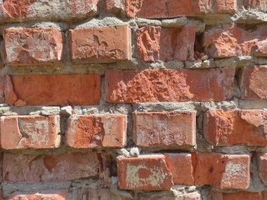 Yıpranmış eski tuğla dokusu. Eski kırmızı tuğlaların arka planı.