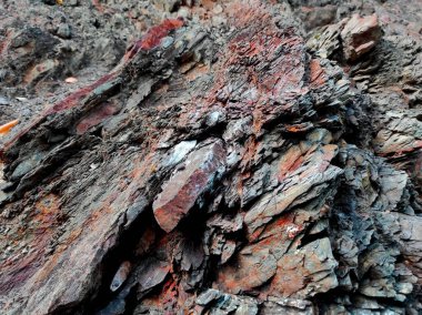 Jeodezi. Taş dokusu. Kaya kahverengi ve kırmızıdır. Mineral arka plan. Doğal malzemelerden dizayn.