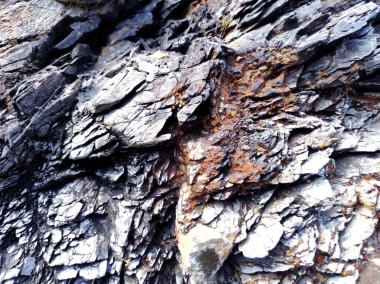 Jeodezi. Taş dokusu. Kaya kahverengi ve kırmızıdır. Mineral arka plan. Doğal malzemelerden dizayn.