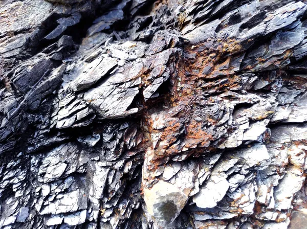 Jeodezi. Taş dokusu. Kaya kahverengi ve kırmızıdır. Mineral arka plan. Doğal malzemelerden dizayn.