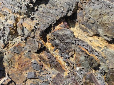 Jeodezi. Taş dokusu. Kaya kahverengi ve kırmızıdır. Mineral arka plan. Doğal malzemelerden dizayn.