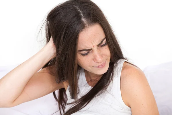 Woman wakes up with a sore head — Stock Photo, Image