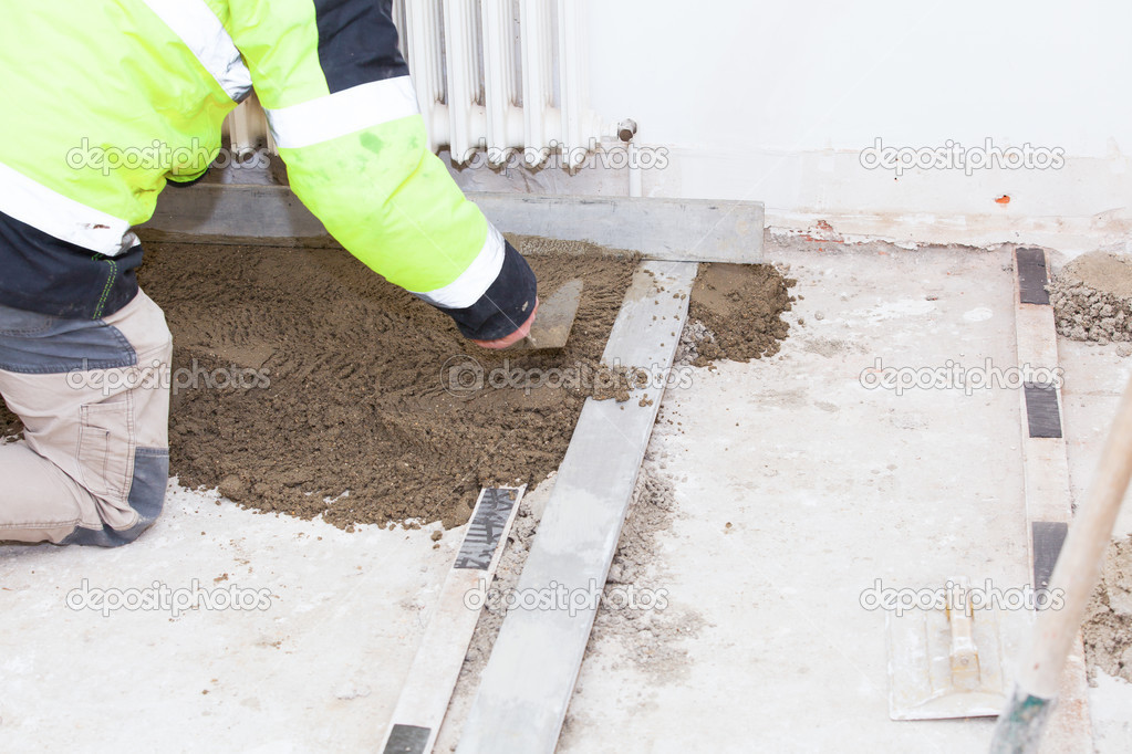 mason building a cement screed