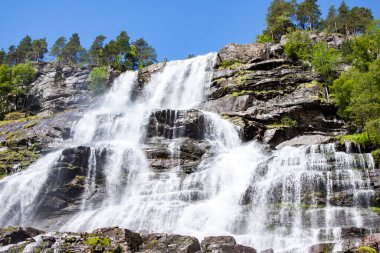 View of Tvindefossen or Tvinnefossen waterfall near Voss in Norway