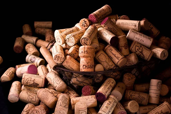 old cork stoppers of French wines in a wire basket