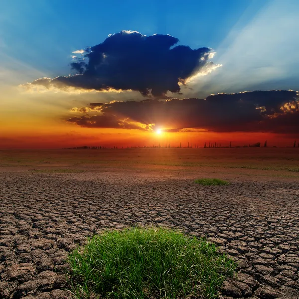 Dramatic sunset over barren earth Stock Image