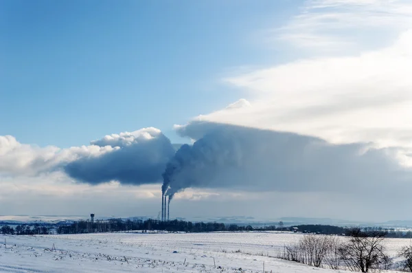 Smokestack pollutions in sky. winter time — Zdjęcie stockowe