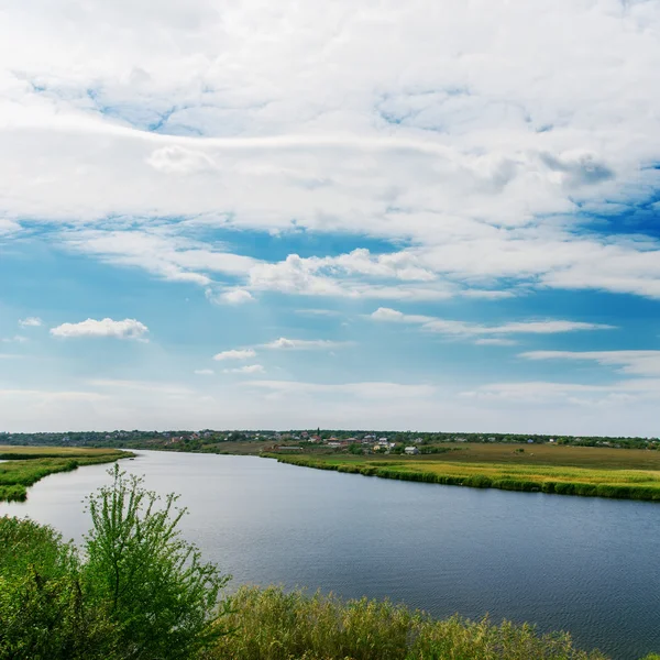 Cloudy sky and river — Stock Photo, Image