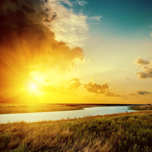 Orange sunset over river — Stock Photo, Image