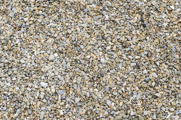 Achtergrond met kleine afgeronde steentjes — Stockfoto