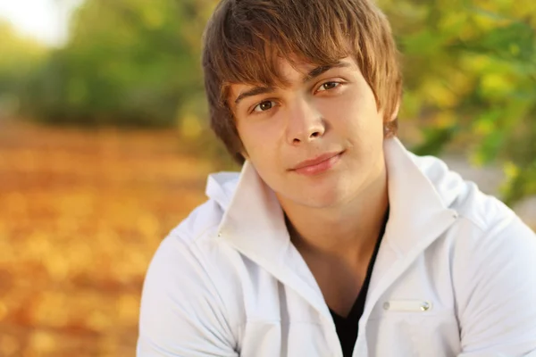 Portrait of young handsome man, outdoor autumn — Stock Photo, Image